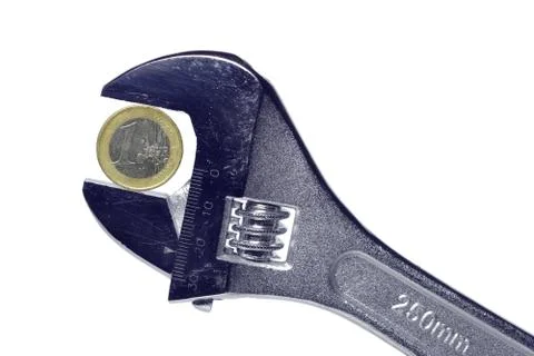 Spanner with coin Stock Photos