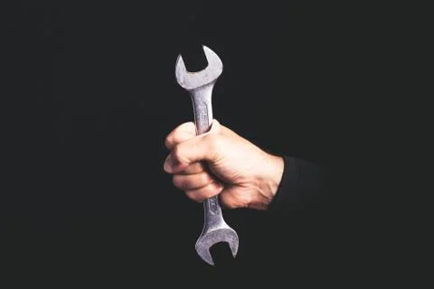 Spanner - tools in a man hand - maintenance service concept Stock Photos
