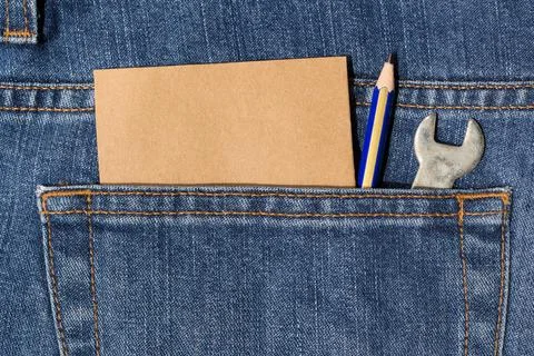 Spanner,pencil and note paper in pocket Stock Photos