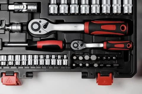 Spanners of various sizes with various hex sockets in a black box Stock Photos
