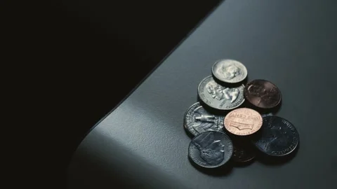 Spare change on a countertop Stock Footage 320188629