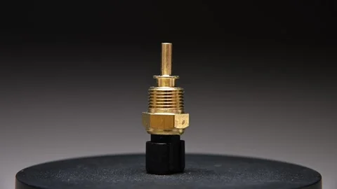 Spare part. New engine coolant temperature sensor. Rotating new part on a 스톡 동영상 328911614