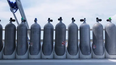 Spare scuba tanks lined up on dive boat Stock Footage 87374324