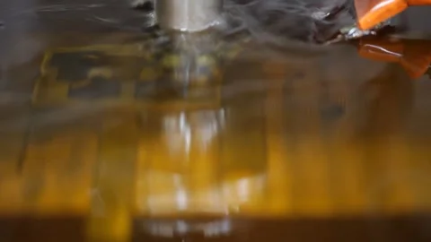 Spark erosion machine in operation sculpting a piece of metal.  Stock Footage 247972115