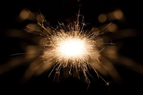 A spark over black background Stock Photos