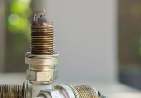 Spark plug plug combusion part mechanical concept Stock Photos