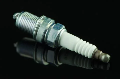 Spark-plug Spark-plug on black reflective background Copyright: xZoonar.co... Stock Photos