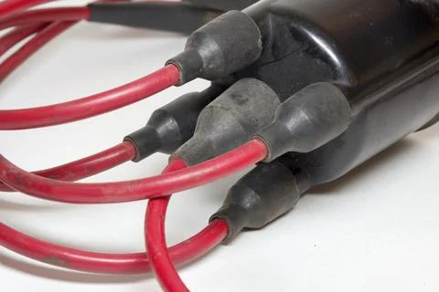 Spark plug wires, red, high tension cables, closeup on rubber boots Stock Photos