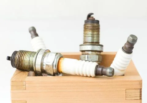 Spark plug in wood box Stock Photos