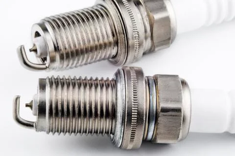 Spark plugs on a light background Stock Photos