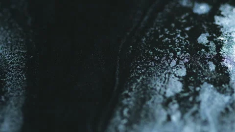 Sparkle fluid spill glitter ink mix black silver Stock Footage 278179211