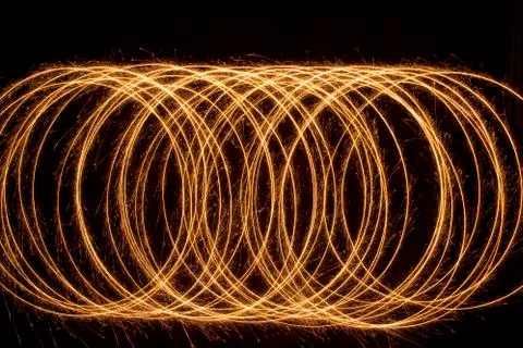 Sparkle multiple circle shape. Burning fire sparklers isolated on black. Stock Photos