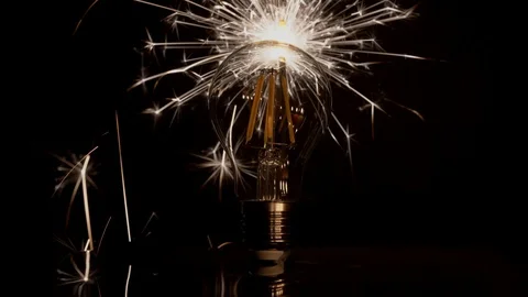 Sparkler Behind LED Light Bulb - Fast Long Sparks 库存影片 99122118
