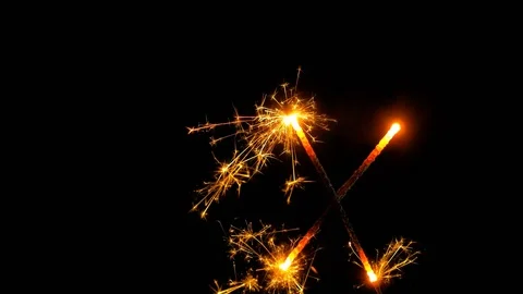 Sparkler on a black background fire in shape of letter X Video stock 82689240