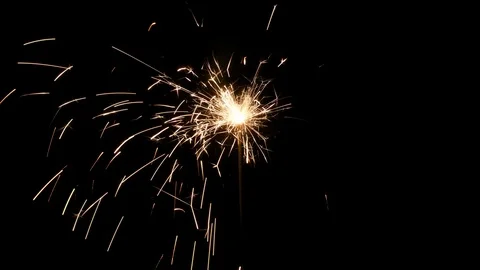 Sparkler on black Stock Footage 99197871