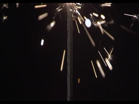 Sparkler burning on a black background, camera moving along, Burning fire Stock Footage 74290956