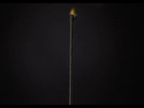Sparkler burning on a black background, close-up, slow motion, Ignition of fire Stock Footage 74288970