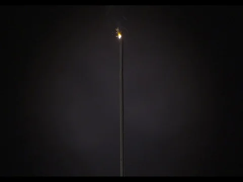 Sparkler burning on a black background, m/s, slow motion, Ignition of fire Stock Footage 74288035