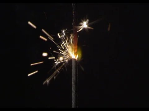 Sparkler burning, close-up, camera moving along, slow motion, Burning fire Stock Footage 74294816