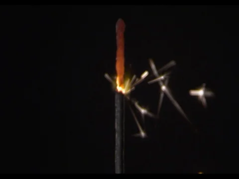 Sparkler burning, close-up, camera moving along, slow motion, Burning fire Stock Footage 74295190