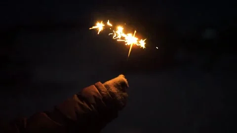 Sparkler burning at night Stock Footage 325668603