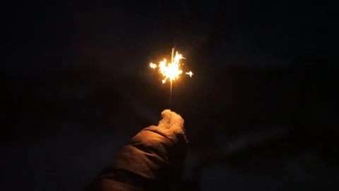 Sparkler burning at night Stock Footage 325668606