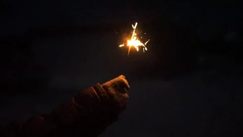 Sparkler burning at night Stock Footage 325668607