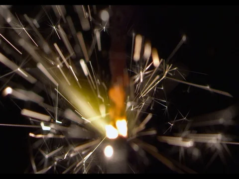 Sparkler burning,macroshot, camera moving along, slow motion,fire burns Stock Footage 74320141