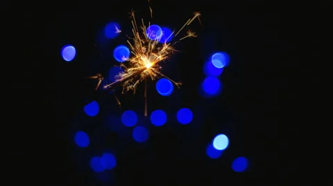 Sparkler burns on the background illumination Stock Footage 44694886