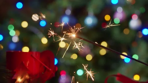 Sparkler with christmas lights Stock Footage 143803948