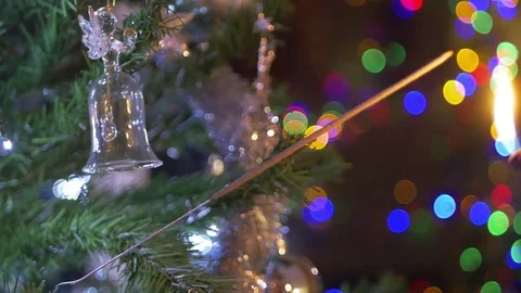 Sparkler in the christmas tree with bell Video stock 71133828
