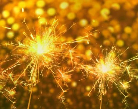 Sparkler close up on bokeh background. Stock Photos
