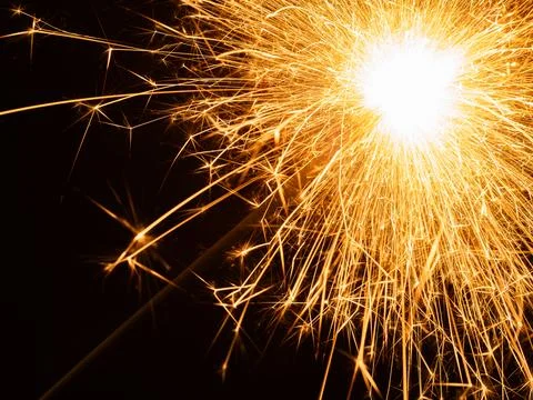 A sparkler closeup on black background Stock Photos