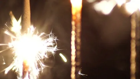 Sparkler on dark background slow motion Stock Footage 73927479