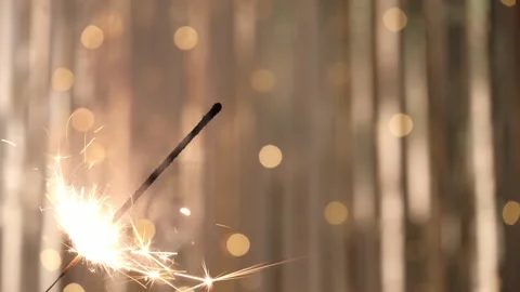 Sparkler with double flame back and forth. closeup. blurred shiny background. Stock-Footage 262865568
