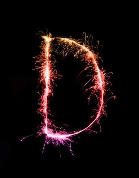 Sparkler firework light alphabet D (Capital Letters) at night Stock Photos