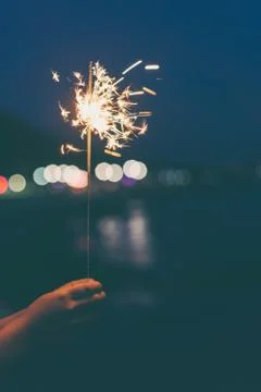 Sparkler in hand Stock Photos