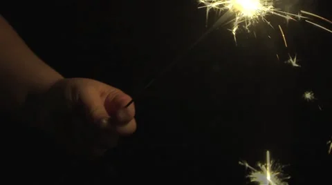 Sparkler held in the dark Stock Footage 45676685