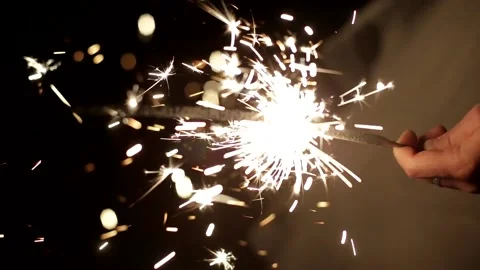 Sparkler in a man's hand in full focus Stock Footage 136915649