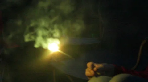 Sparkler sizzles and pops in quiet hands Stock Footage 40205813