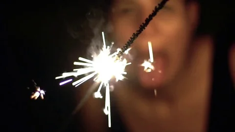 Sparkler in slow motion at night Stock Footage