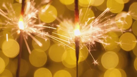 Sparkler sparkles brightly in front of the screen. Two sparklers against a Video stock 247472253