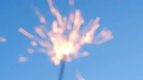 Sparklers against dark blue sky Stock Footage