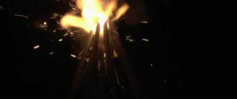 Sparklers burning down in the dark background in slow motion. Stock Footage 132967033