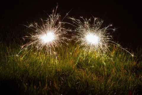 Sparklers in the grass Stock Photos