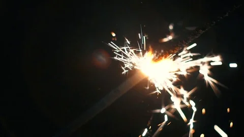 Sparkles Against Dark Background Stock Footage 78717437