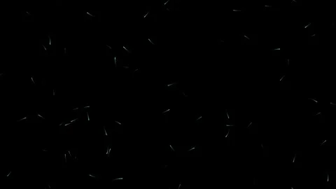Sparkles float and glow against a dark background Stock Footage 345860033