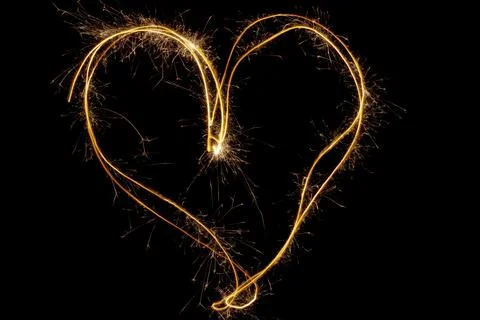 Sparkles heart with sparks, Using camera with slow shutter speed Stock Photos