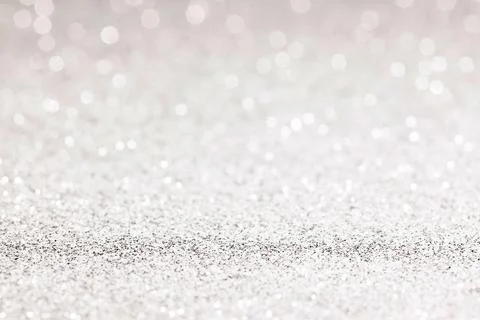 Sparkles of Silver glitter abstract background. Copy space Stock Photos