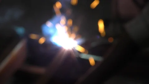 Sparkles of welding machine and arc being used to join the metal Stock Footage 112854024